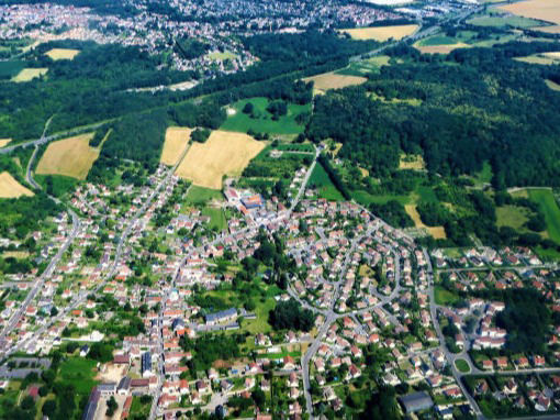 Aerial view over a town shows land available for building with the MAAP hybrid modular system