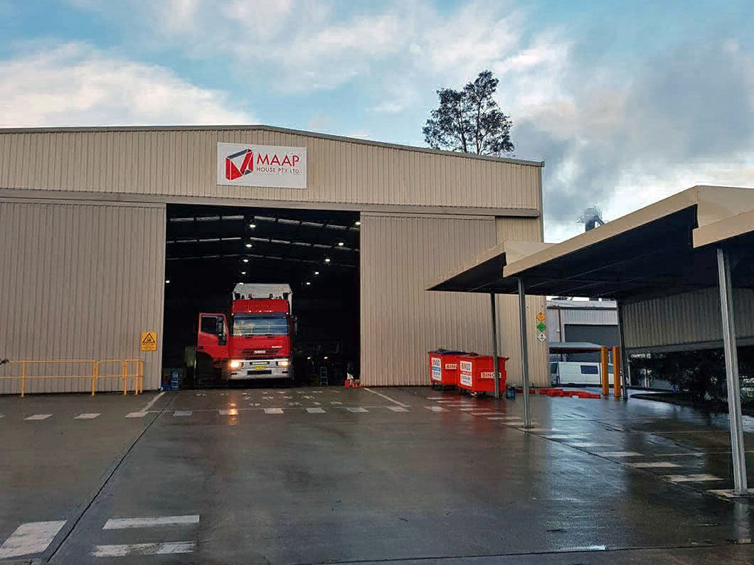 The front of the MAAP Modular factory with a truck loaded ready for delivery