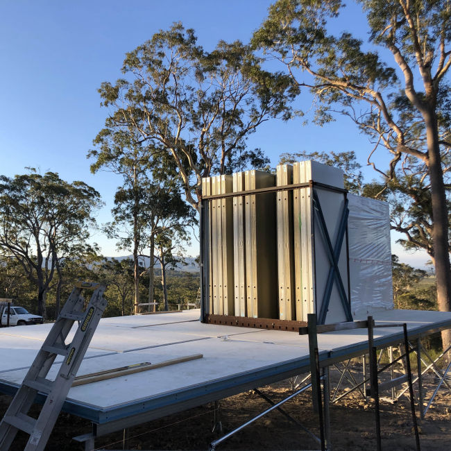 MAAP hybrid modular wall panels are stacked on site ready to be connected to the building