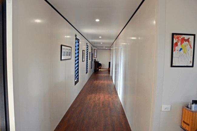 View down a beautiful extra wide hallway in one of our MAAP hybrid modular panelised builds